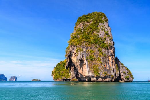 Huge cliff rock in azure water, Ko Rang Nok, Ao Phra Nang Beach, Ao Nang, Krabi, Thailand.