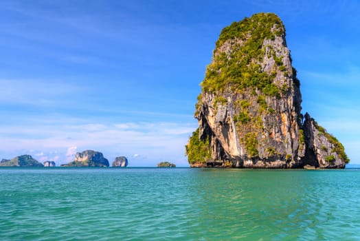 Huge cliff rock in azure water, Ko Rang Nok, Ao Phra Nang Beach, Ao Nang, Krabi, Thailand.