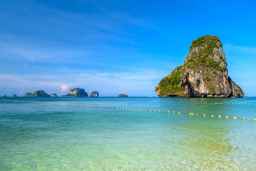 Huge cliff rock in azure water, Ko Rang Nok, Ao Phra Nang Beach, Ao Nang, Krabi, Thailand.