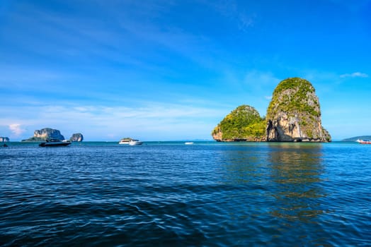 Huge cliff rock in azure water, Ko Rang Nok, Ao Phra Nang Beach, Ao Nang, Krabi, Thailand.