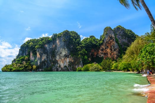 Rocks and cliffs covered with tropical trees, azure water on Ao Phra Nang Beach, Railay east Ao Nang, Krabi, Thailand.