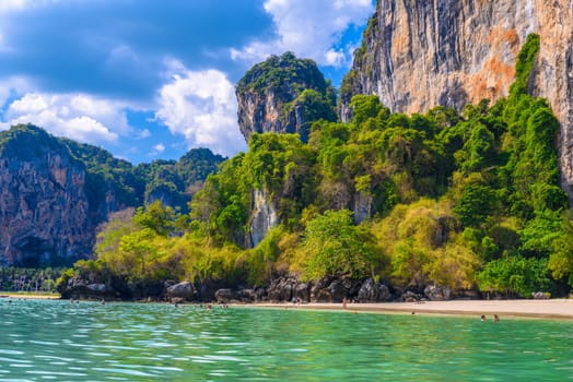 Rocks and cliffs, water and tropical white sand beach, Railay beach west, Ao Nang, Krabi, Thailand.