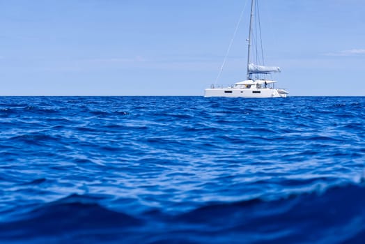 Yacht catamaran on the sea. Catamaran sailing on turquoise waters. Holiday or vacation at sea. Luxury yachts. summer