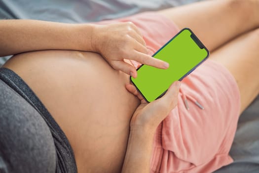 Pregnancy mockup app. Mobile pregnancy online maternity application. Pregnant mother using phone mock up. Pregnancy, medicine, pharmaceutics, health care and people concept.
