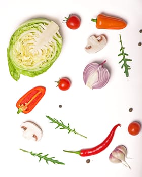 Food with raw fresh salad ingredients on white wooden background. View from above.