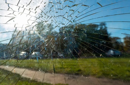 Broken glass at a street bus stop . High quality photo