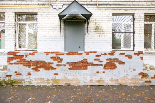 Old Vintage Red Brick Wall With Sprinkled White Plaster Texture Background. High quality photo