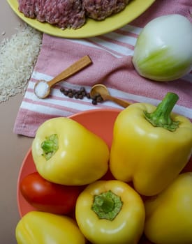 Background with a place for text - ingredients for stuffing pepper with minced meat