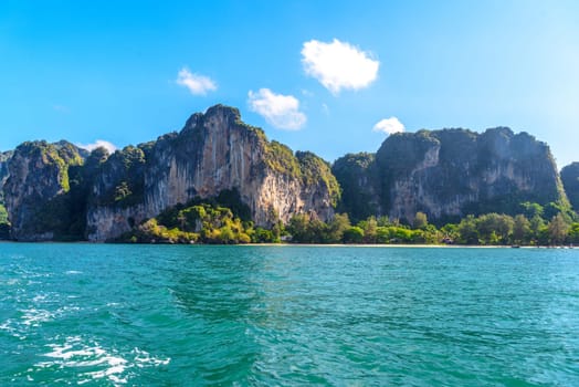 Huge cliff rocks in azure water, Railay beach, Ao Nang, Krabi, Thailand.