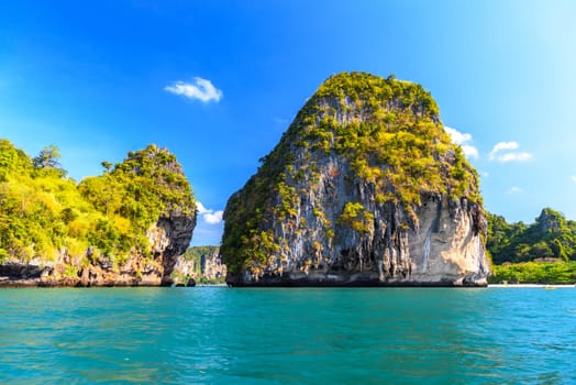 Huge cliff rock in azure water, Ko Rang Nok, Ao Phra Nang Beach, Ao Nang, Krabi, Thailand.