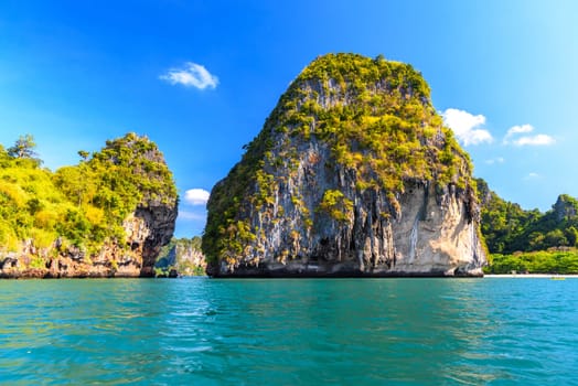 Huge cliff rock in azure water, Ko Rang Nok, Ao Phra Nang Beach, Ao Nang, Krabi, Thailand.