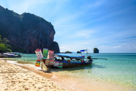 KRABI, THAILAND- MARCH 2018: Long tail boats and cliff rock in azure water, Ko Rang Nok, Ao Phra Nang Beach, Ao Nang, Krabi, Thailand.