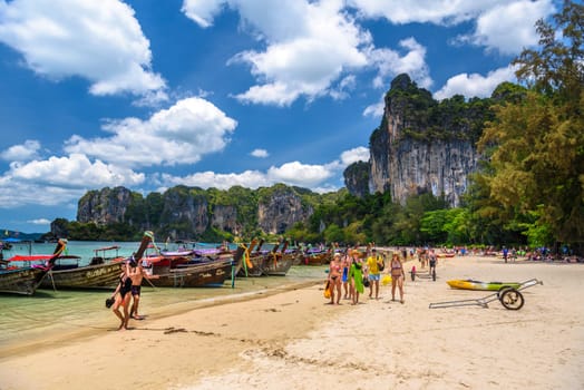 KRABI, THAILAND- MARCH 2018: Long tail boats and rocks on Railay beach west, Ao Nang, Krabi, Thailand.