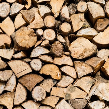 Woodpile of birch firewood, close up, background Texture
