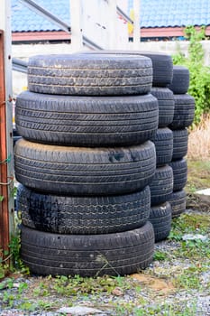 The old tires stacked in the field