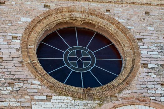 spello rose window of a church in the historic center architecture