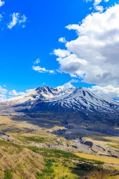 Snow on Mount St. Helens against Blue Sky and cloudscape