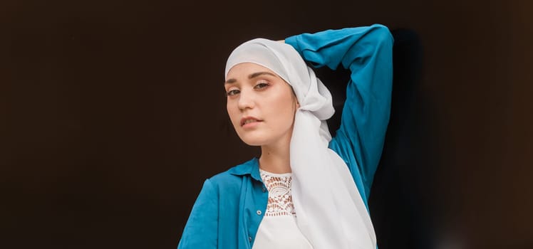 Modern muslim girl fashion with hijab.Beautiful Muslim female model wearing hijab and casual outfit posing on urban background.