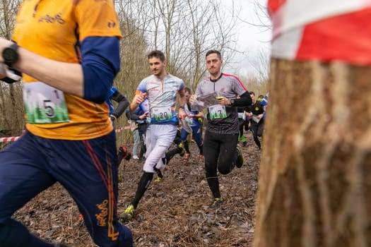 Grodno, Belarus - 26 March, 2023: Mass start of the relay at competitions in outdoor orienteering Grodno Forest Day. Belarus, hobby sport.