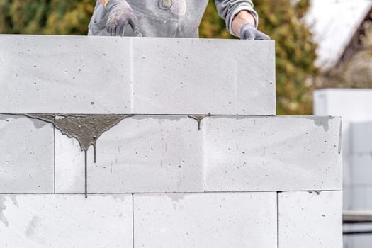 construction of a wall of a house made of aerated concrete blocks.