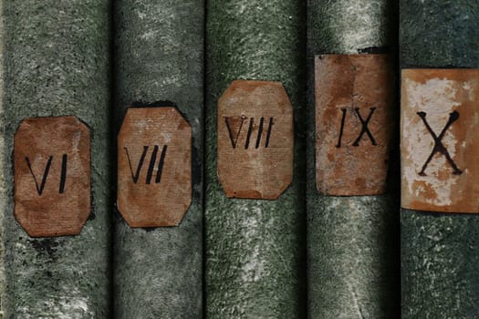 Old books with Roman numerals in the library archive