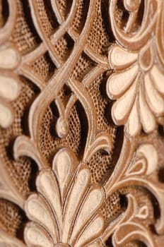 A close-up of vintage oriental artistic wood carving. Central Asia, Uzbekistan