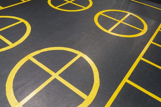 The yellow marks on the floor in the gym