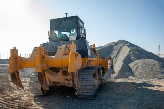 A Tractor working in a industrial construction area