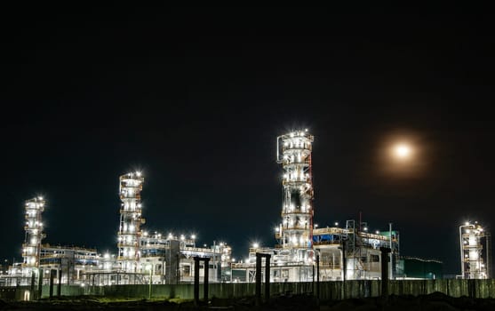 The oil refinery factory at night