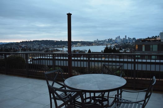 Sunrise on a Hotel Rooftop Patio with View of Seattle Washington . High quality photo