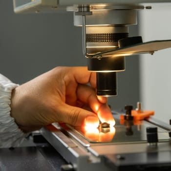 A closeup of the production and quality control of the internal parts of medical syringes