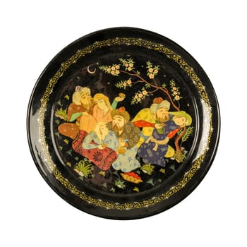 A top view of an oriental ceramic plate depicting couples painted in the center on a white background, Uzbekistan