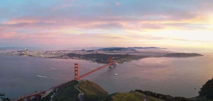 Panoramic view of Golden Gate Bridge and San Francisco at sunset. High quality photo