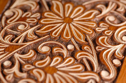 A close-up of vintage oriental artistic wood carving. Central Asia, Uzbekistan