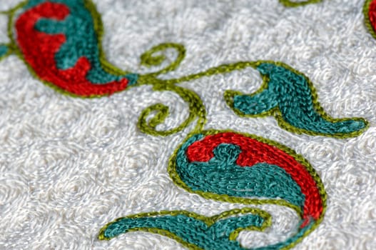 A closeup shot of national ornaments and patterns of Central Asia on a piece of fabric