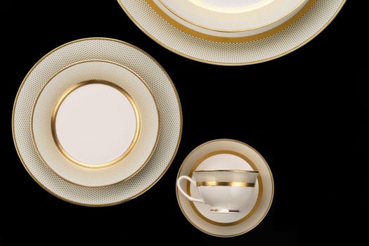 A luxury tableware set isolated on black backgroundм