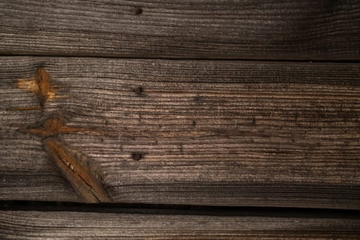 Wood texture natural background. Dark brown scratched wooden cutting board