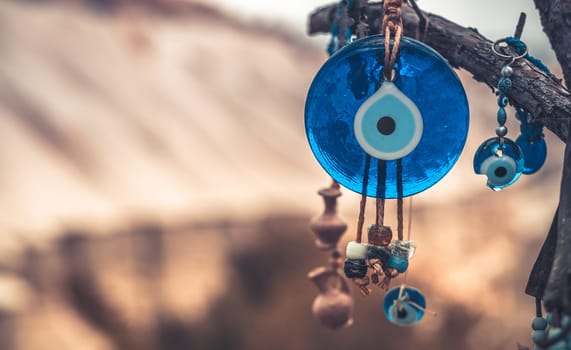 Close up view of evil eye amulet on mountain background in Cappadocia, Turkey