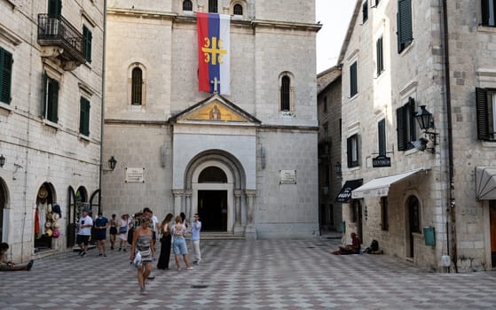 Kotor, Montenegro - 27 June 2021: Ancient church in Kotor, Montenegro. Old chapel with beautiful european architecture with tourists