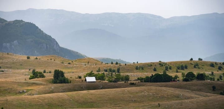 National park Durmitor in Montenegro, scenic view with mountains and houses. Amazing balkan nature