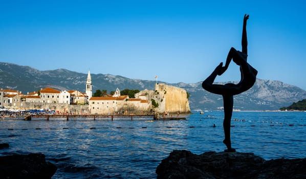 Ballerine sculpture in Budva, Montenegro. View on monument on coast of Adriatic sea