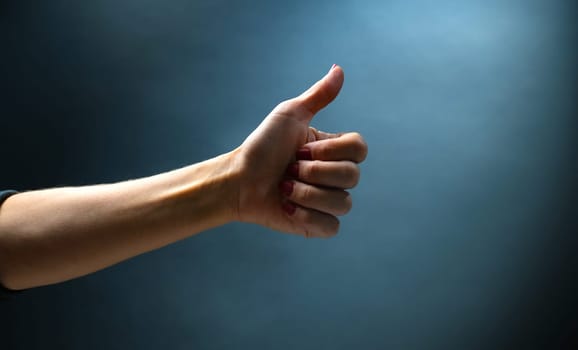 Hand shows sign fine holding finger up. Concept of gesture communication with visual symbols