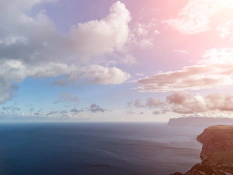 Blue sky with white clouds over calm summer panorama of the sea. Drone aerial view. Abstract aerial nature summer ocean sunset sea and sky background. Horizon. No people. Holiday and vacation concept