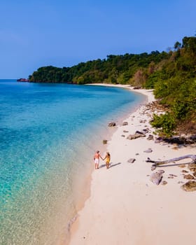 drone view at the beach of Koh Kradan island in Thailand, aerial view over Koh Kradan Island Trang during vacation in Thailand