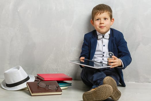 little kid holding a light-bulb.