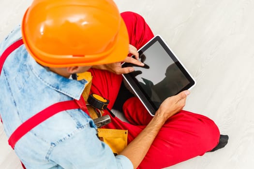 Builder Holding Digital Tablet On White Background