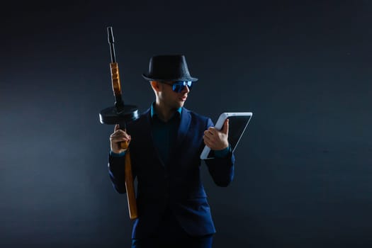 Mature Business Man Holding Gun on a dark background.