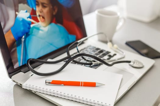 Stethoscope on laptop keyboard. Health care or IT security concept.