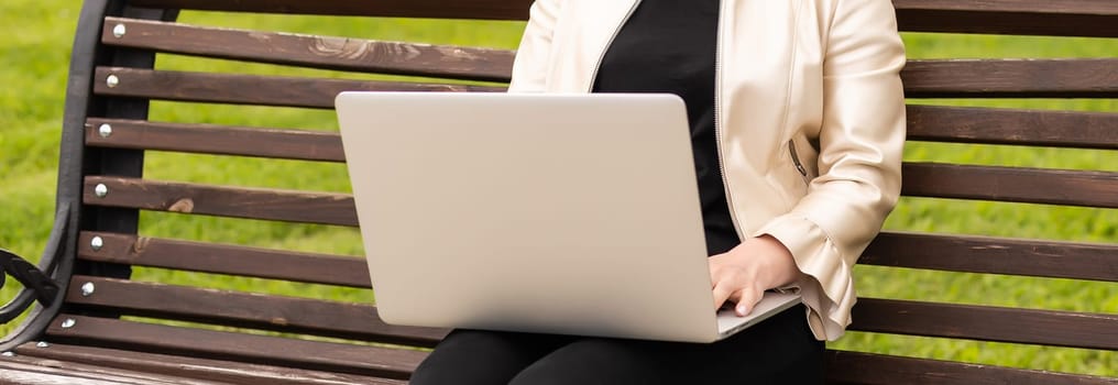 Image of elegant employer sitting on the bench.