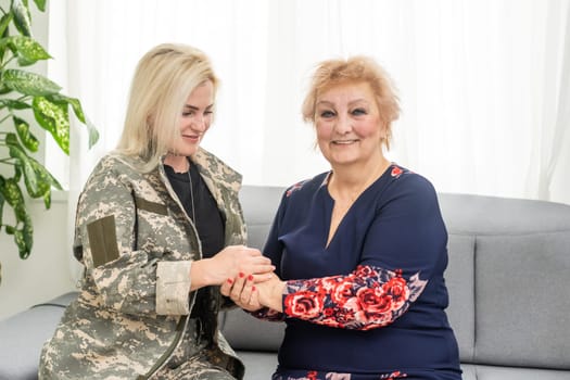 military woman and elderly mother at home.